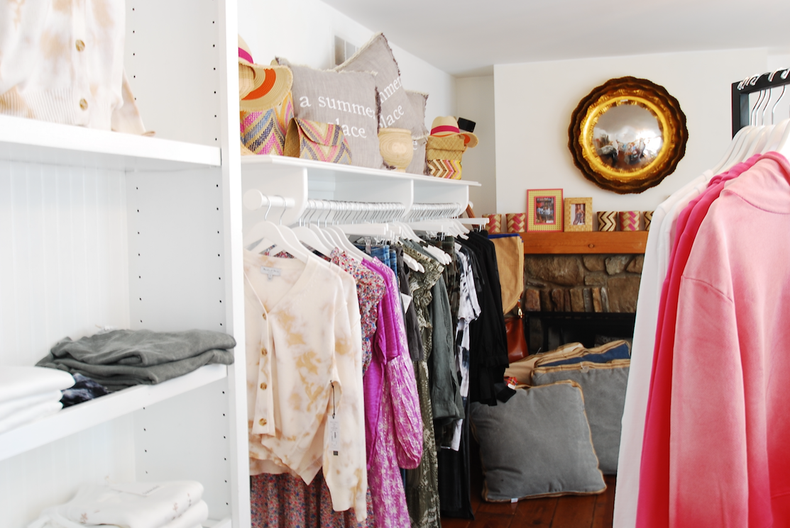 Racks of women's clothing and soft sweaters in the shop